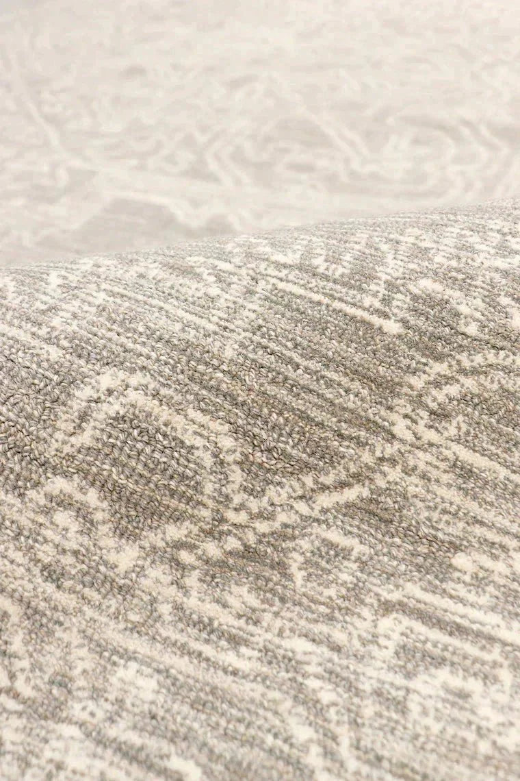 Close-up of a textured beige fabric with subtle patterns