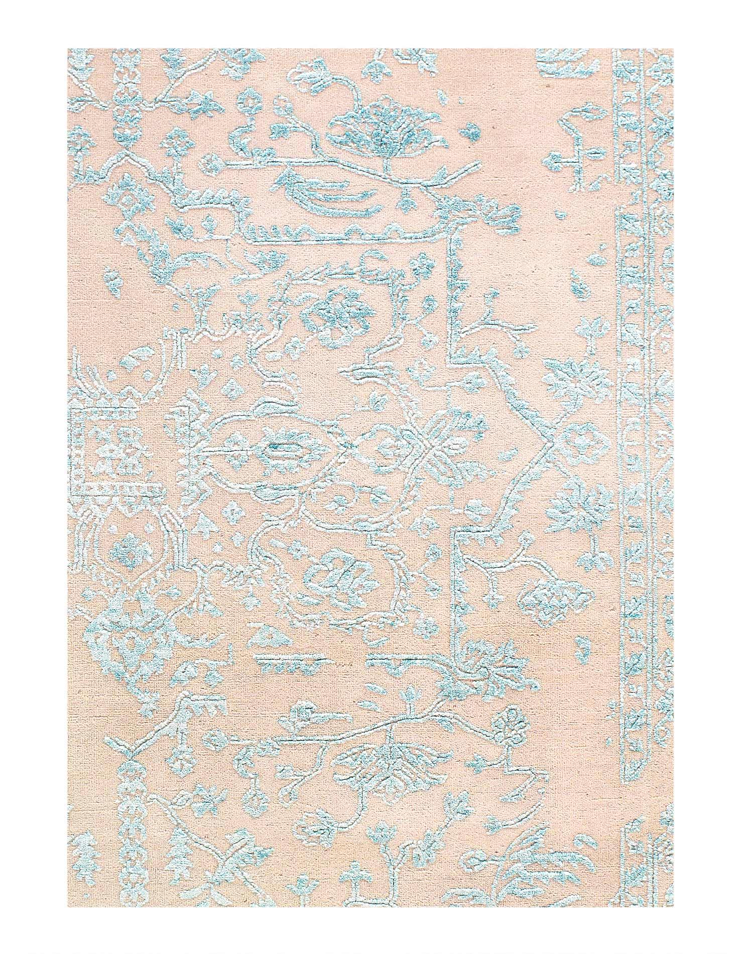 Patterned rug with blue and beige design on a light pink background