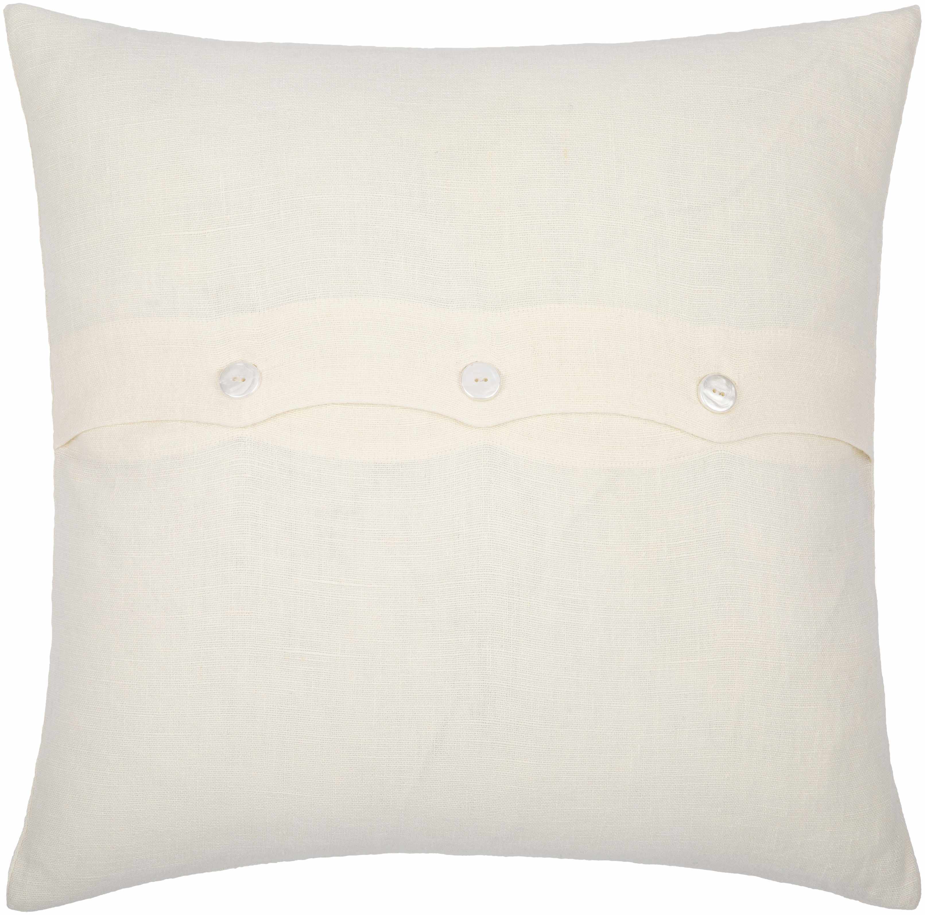 White pillow with button details on a white background