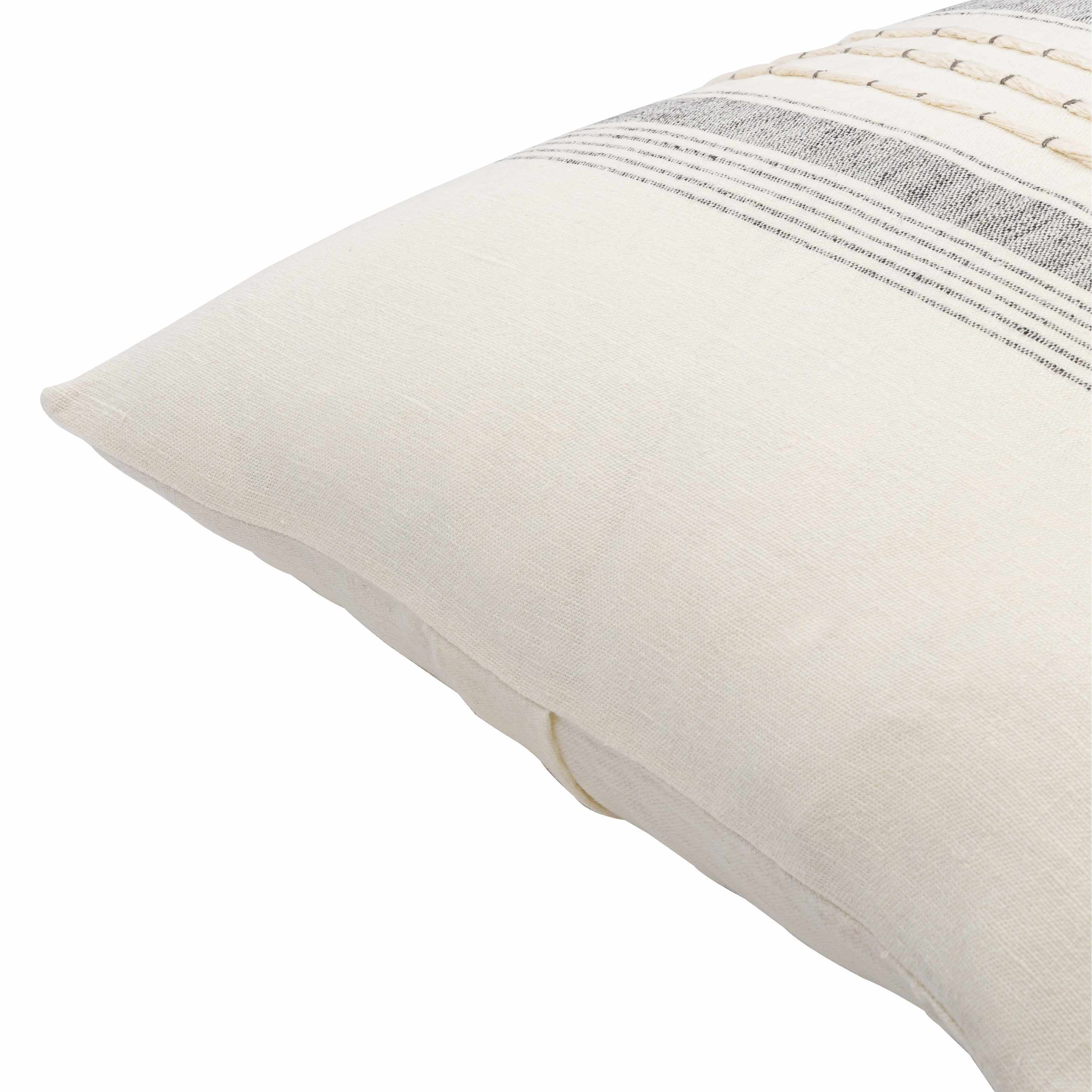 Beige pillow with textured pattern on a white background