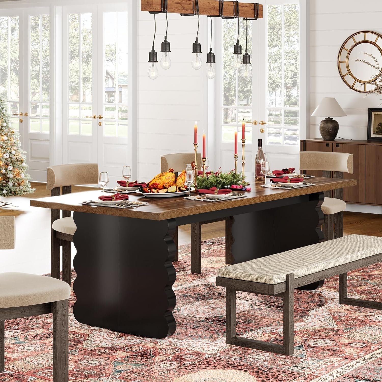Dining room with a table set for a meal, including candles and wine bottles, with chairs and a bench.
