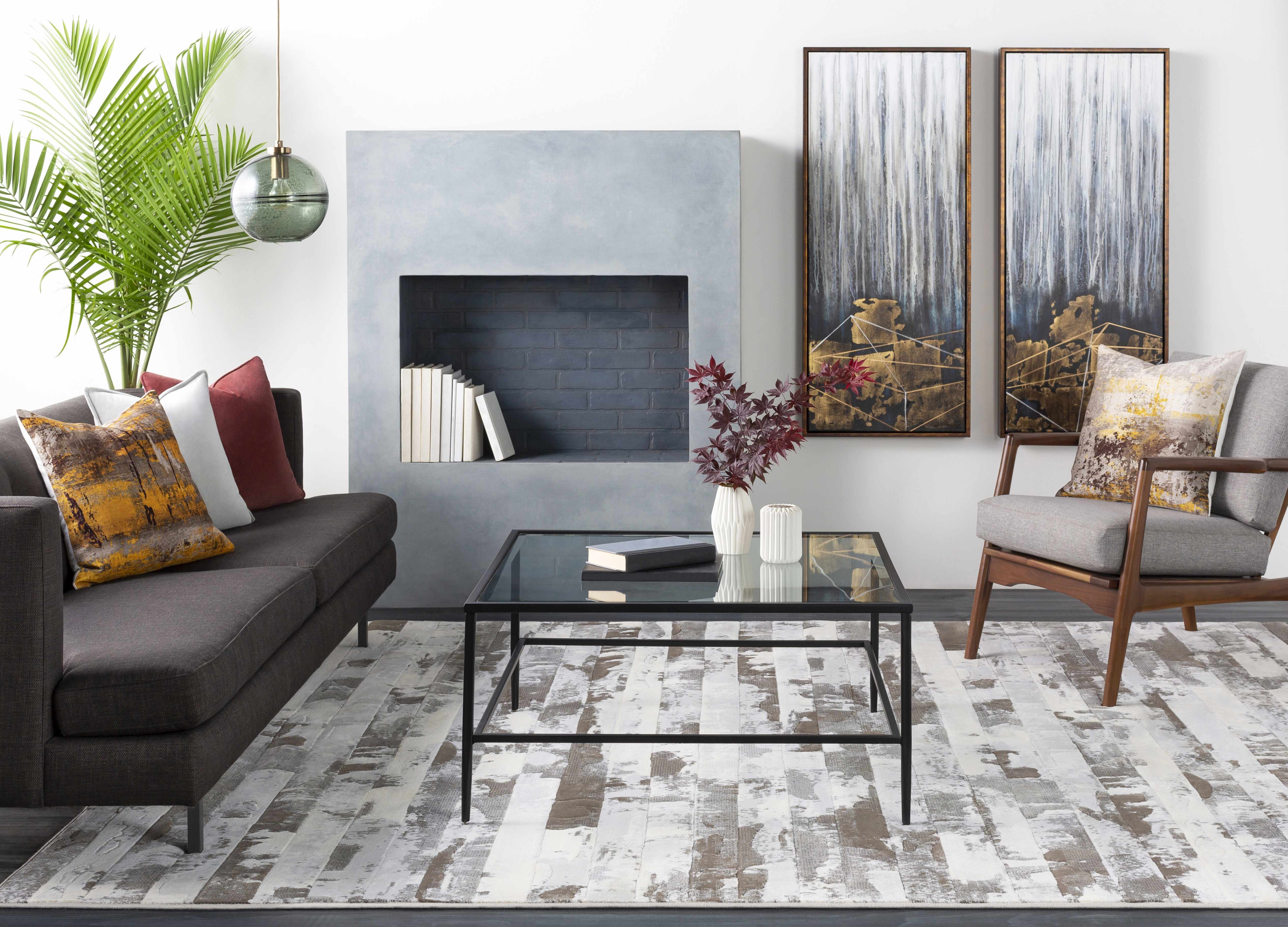 Modern living room with gray sofa, coffee table, and decorative elements.