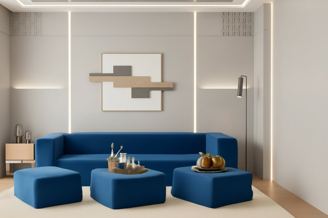 Blue sofa set with ottomans in a modern living room setting.