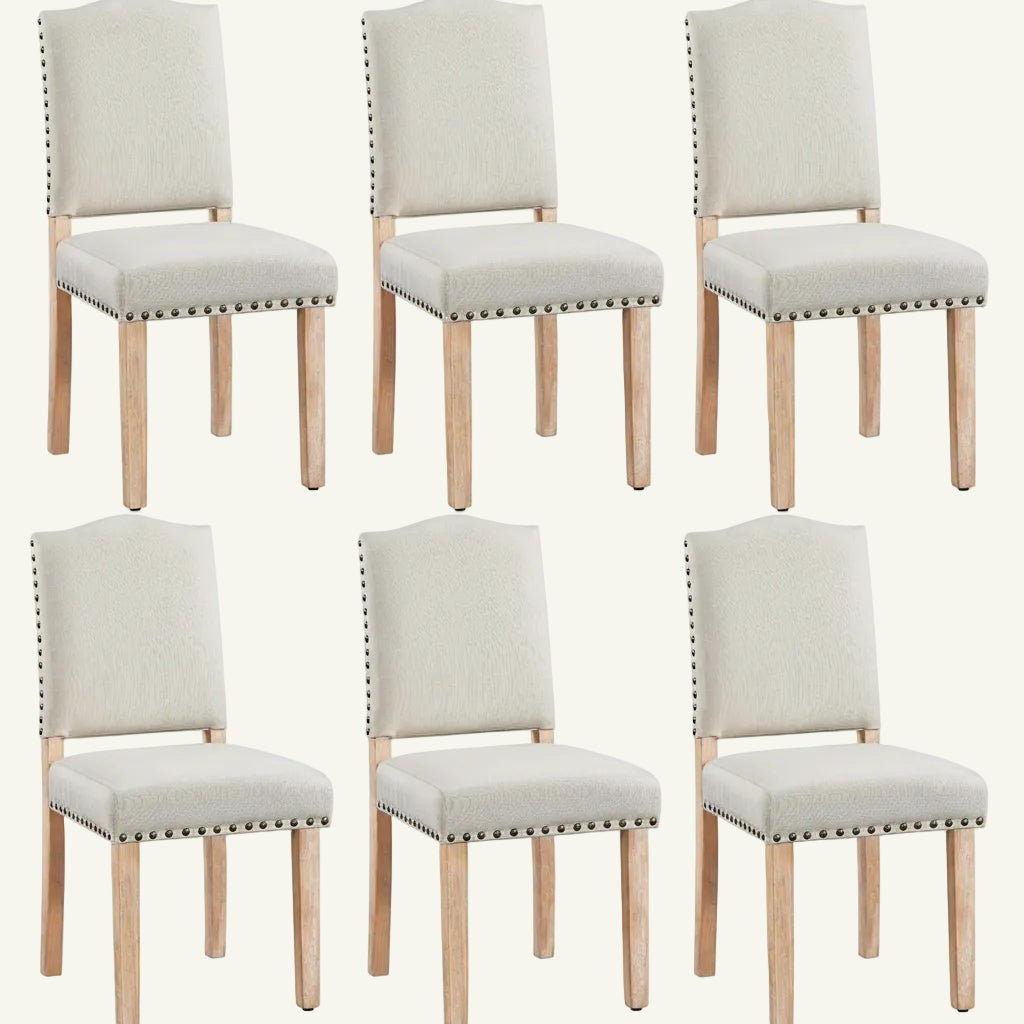 Set of six beige upholstered chairs with wooden legs on a white background