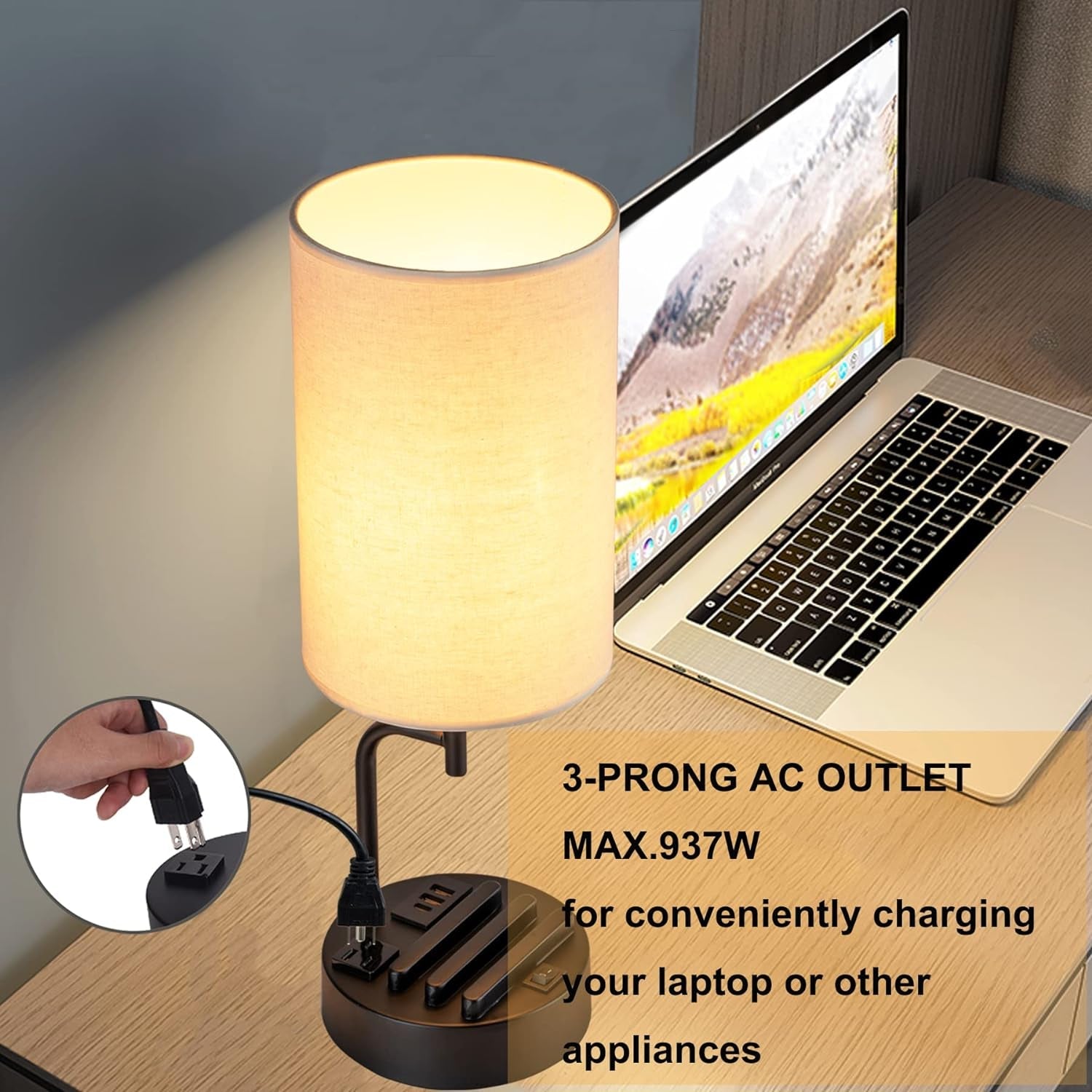 Table lamp with 3-prong AC outlet on a desk next to a laptop