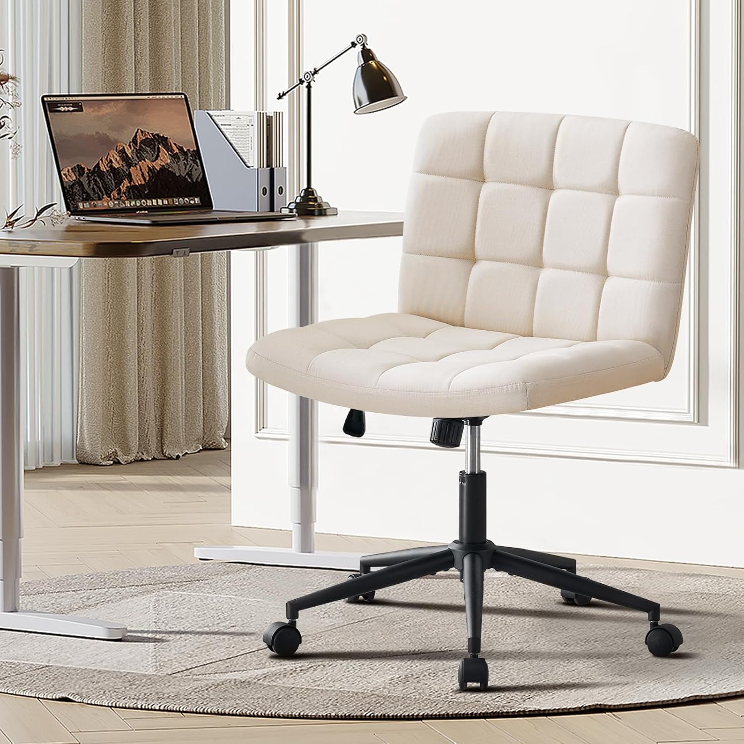 Beige office chair in front of a desk with a laptop in a home office setting.