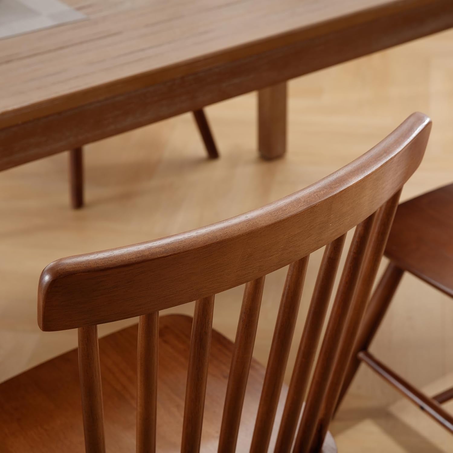 Wooden chair and dining table set in a warm-toned room