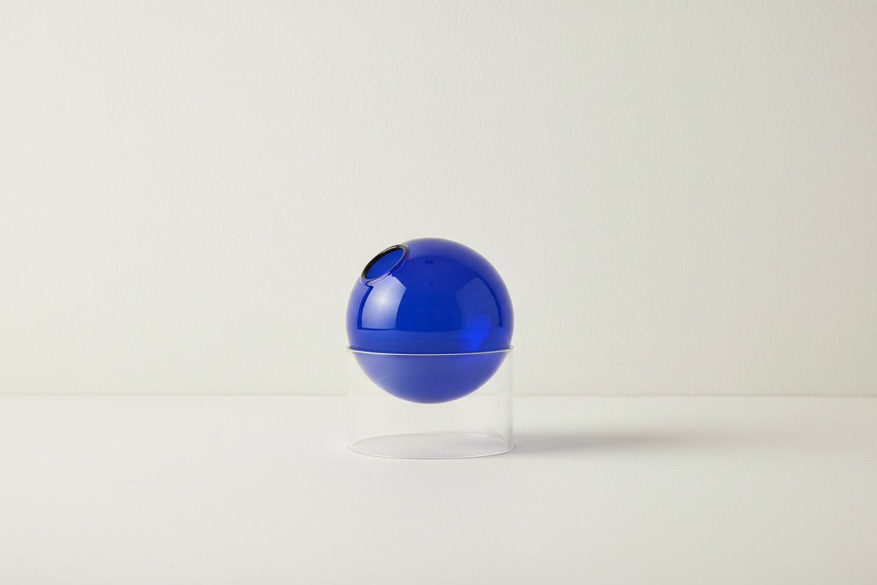 Blue spherical object on a clear stand with dimensions labeled