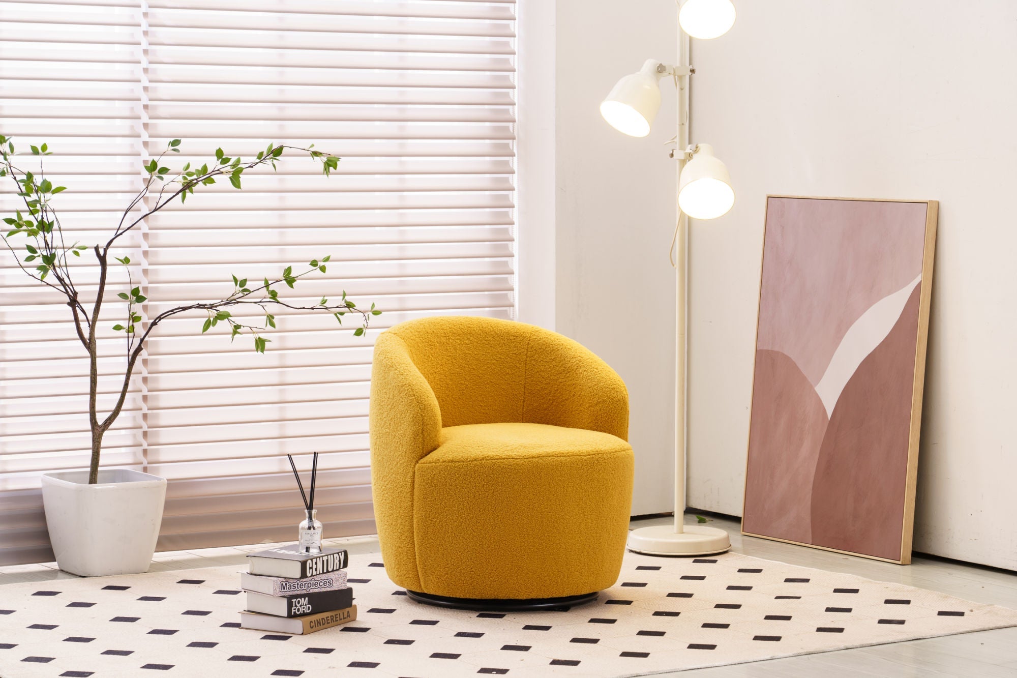 Yellow armchair in a modern living room with a plant and books on a patterned rug.