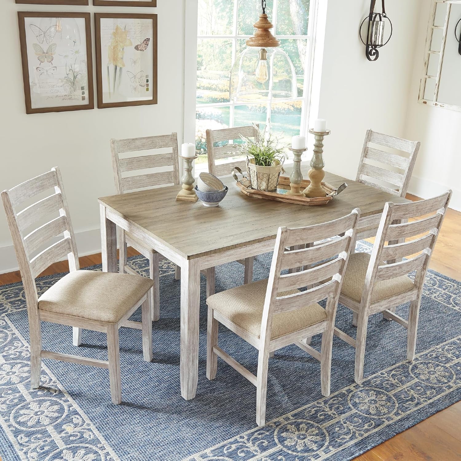 Dining room with wooden table and chairs on a blue patterned rug