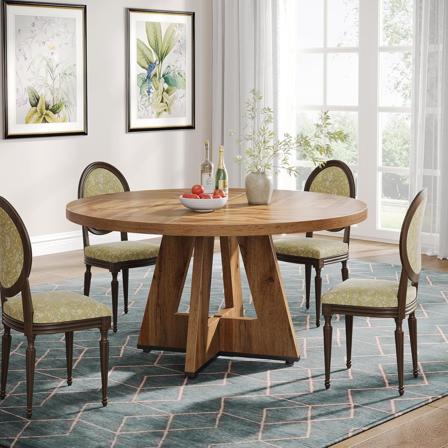 Dining room with a wooden table and chairs on a patterned rug.