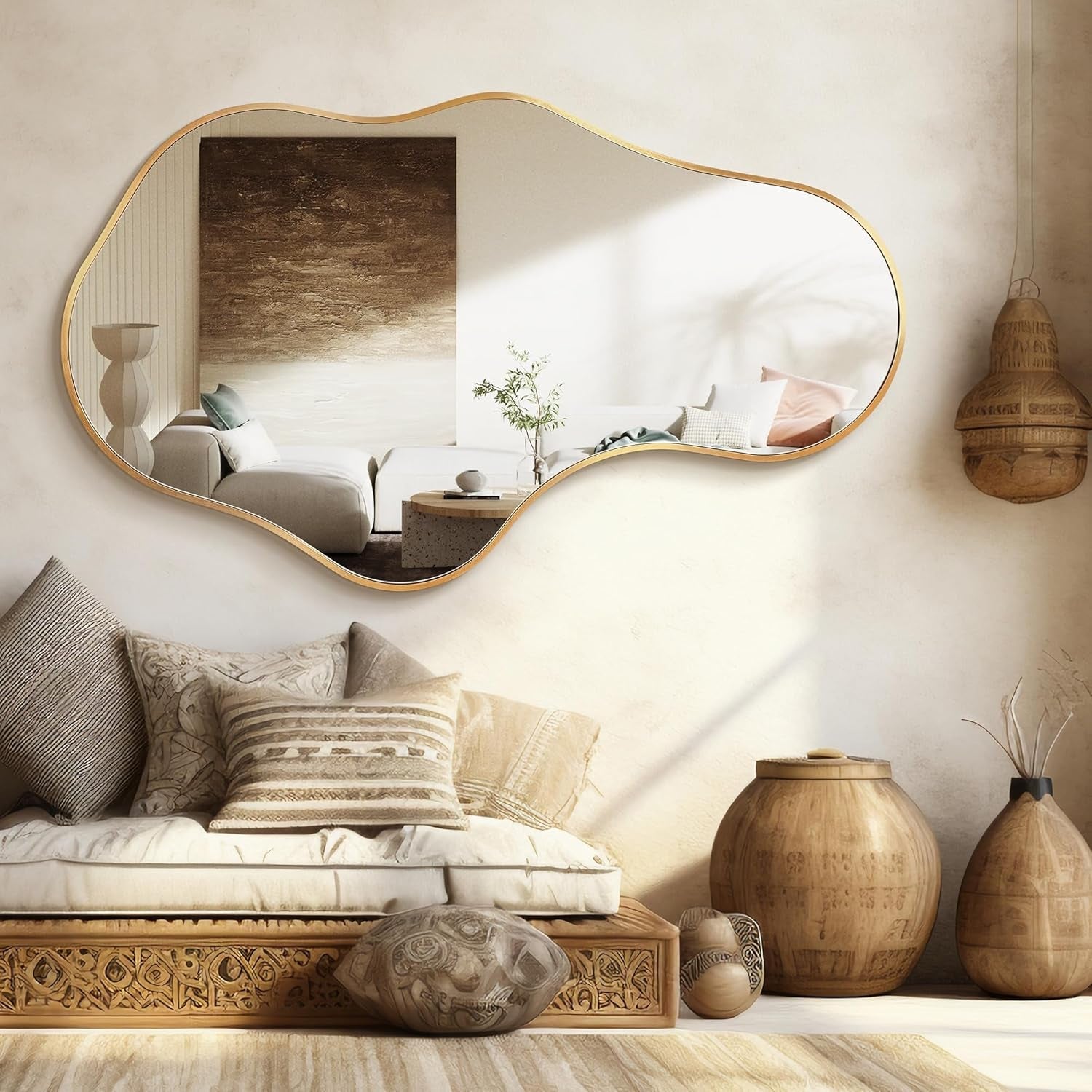 Decorative living room with a wavy mirror, textured pillows, and wooden vases.