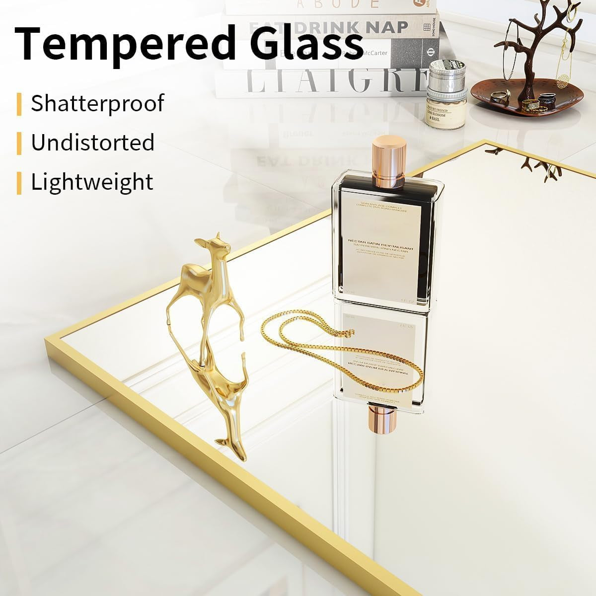 Tempered glass display table with decorative items on a white surface