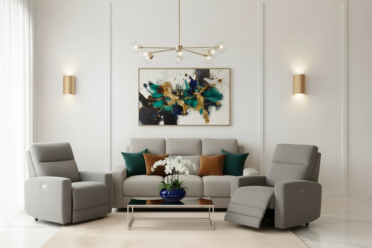 Gray sofa set with two armchairs in a modern living room with beige walls and wooden floor.