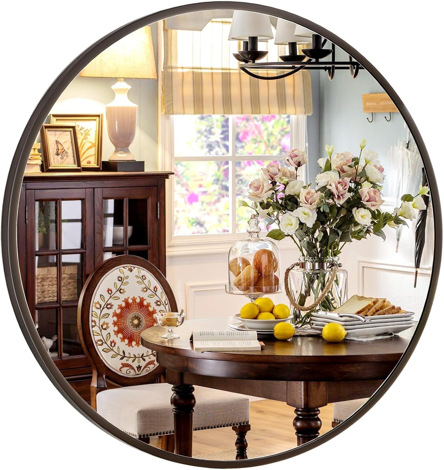 Round mirror reflecting a cozy dining room with a table, chairs, and decorative items.