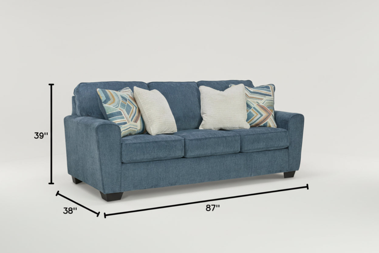 Blue sofa with decorative pillows and dimensions displayed