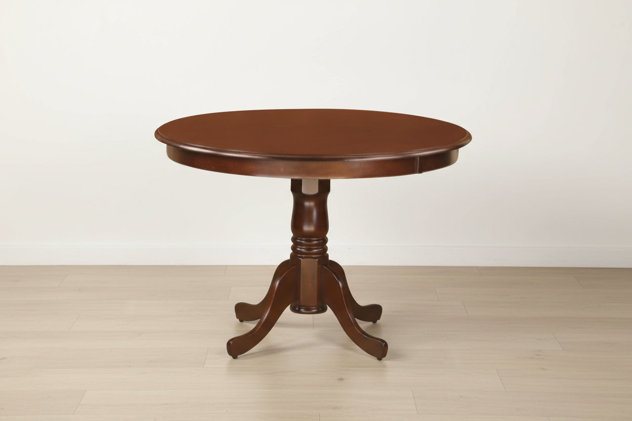 Round wooden table with a pedestal base on a white background