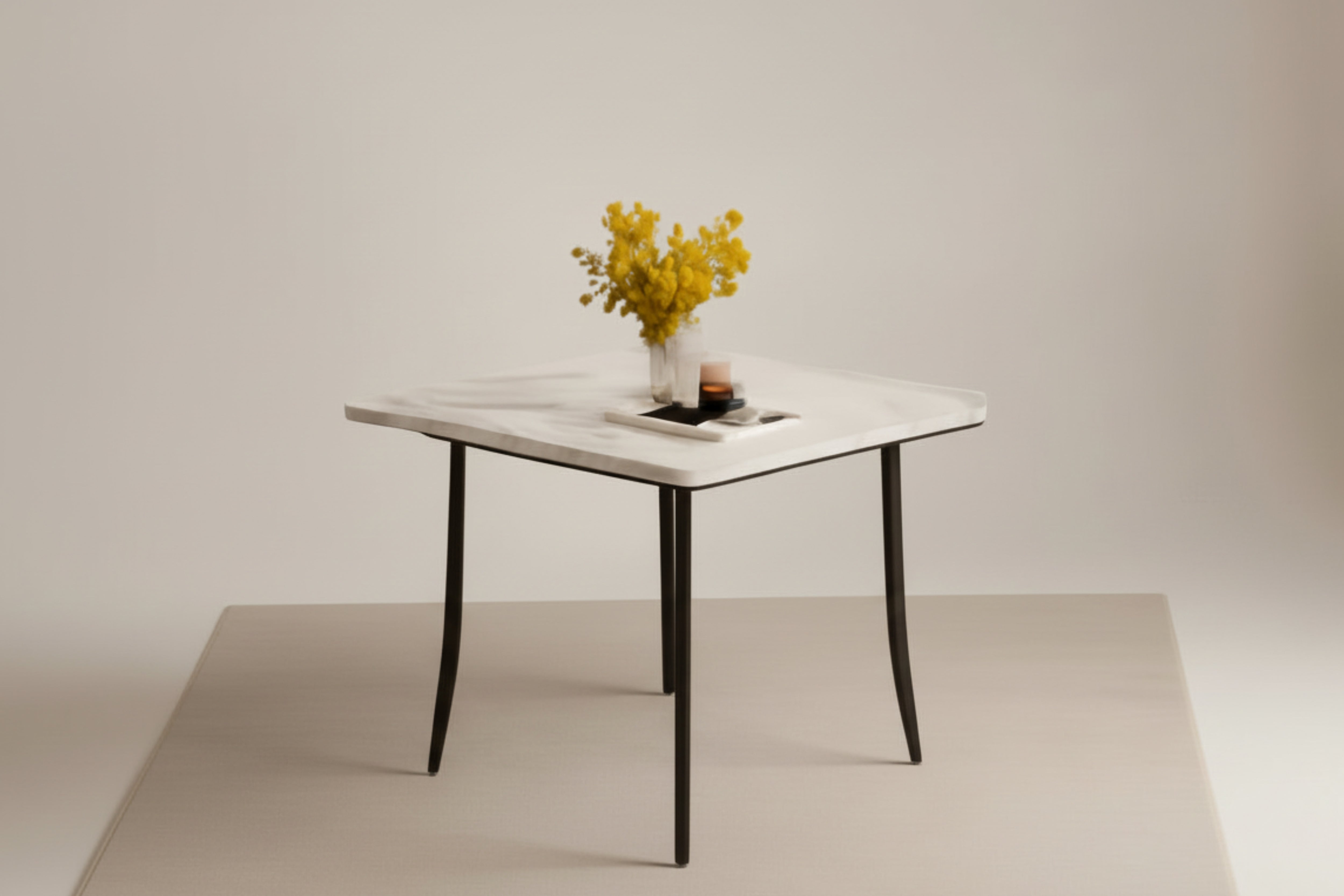 Dining table with four chairs in a room with a lamp and vase on the table.