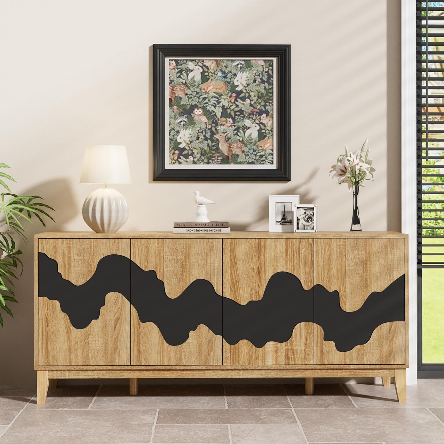 Wooden sideboard with black abstract designs in a living room setting.