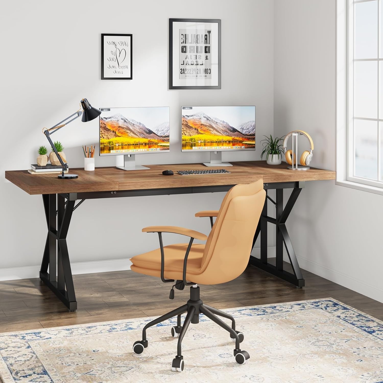 Modern home office with a wooden desk, computer setup, and chair.
