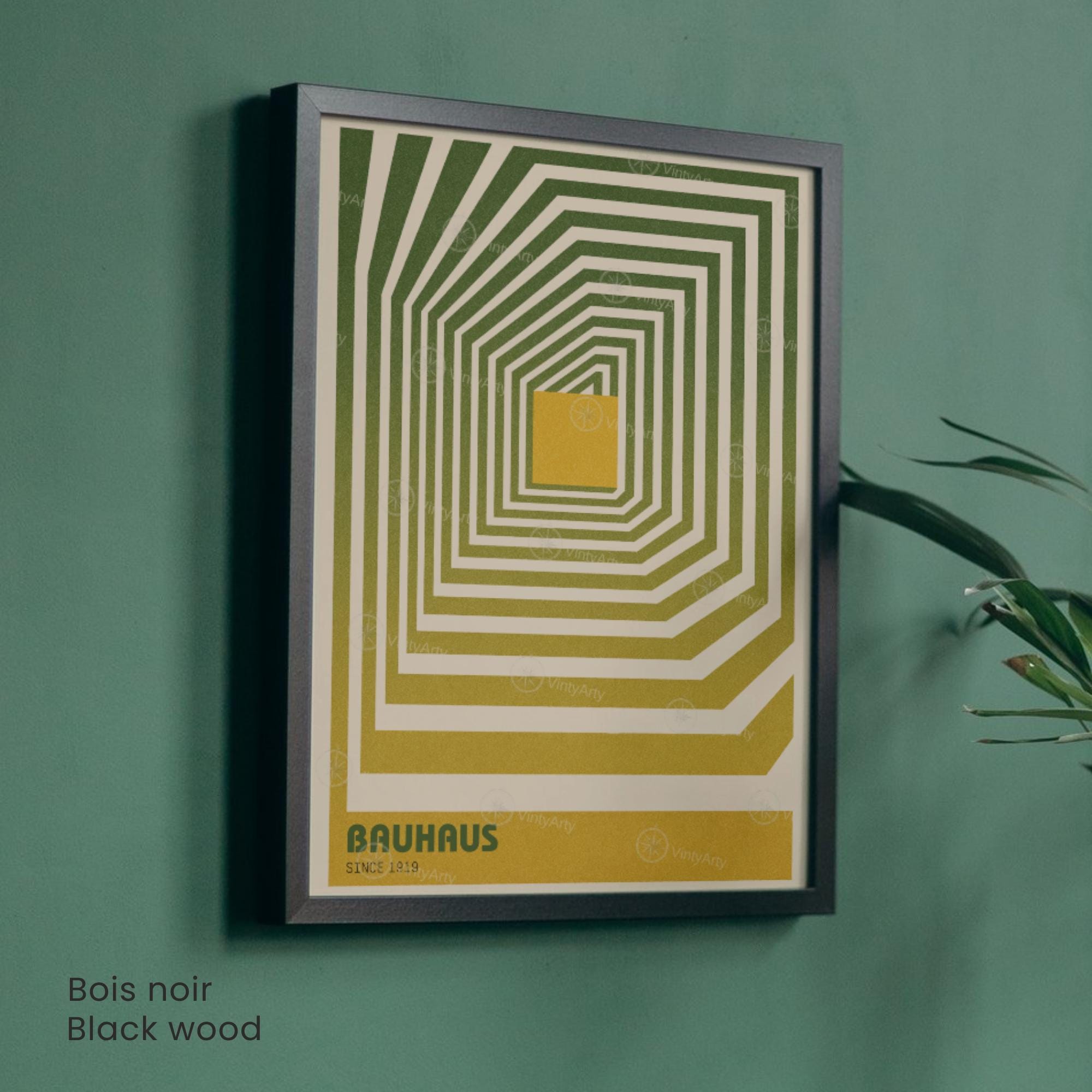 Framed geometric art print with a yellow and green pattern on a teal wall.