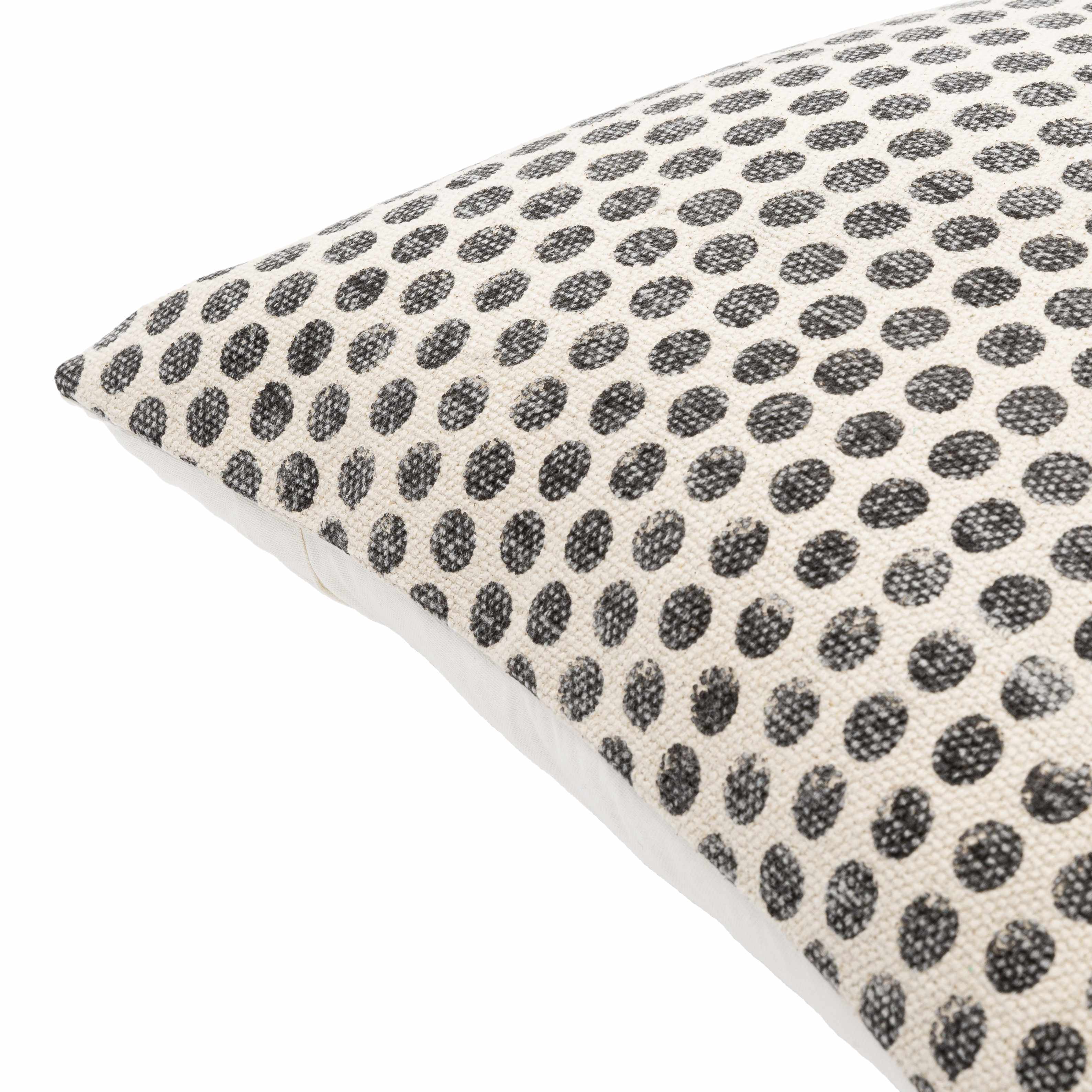 Cushion with black dot pattern on a white background