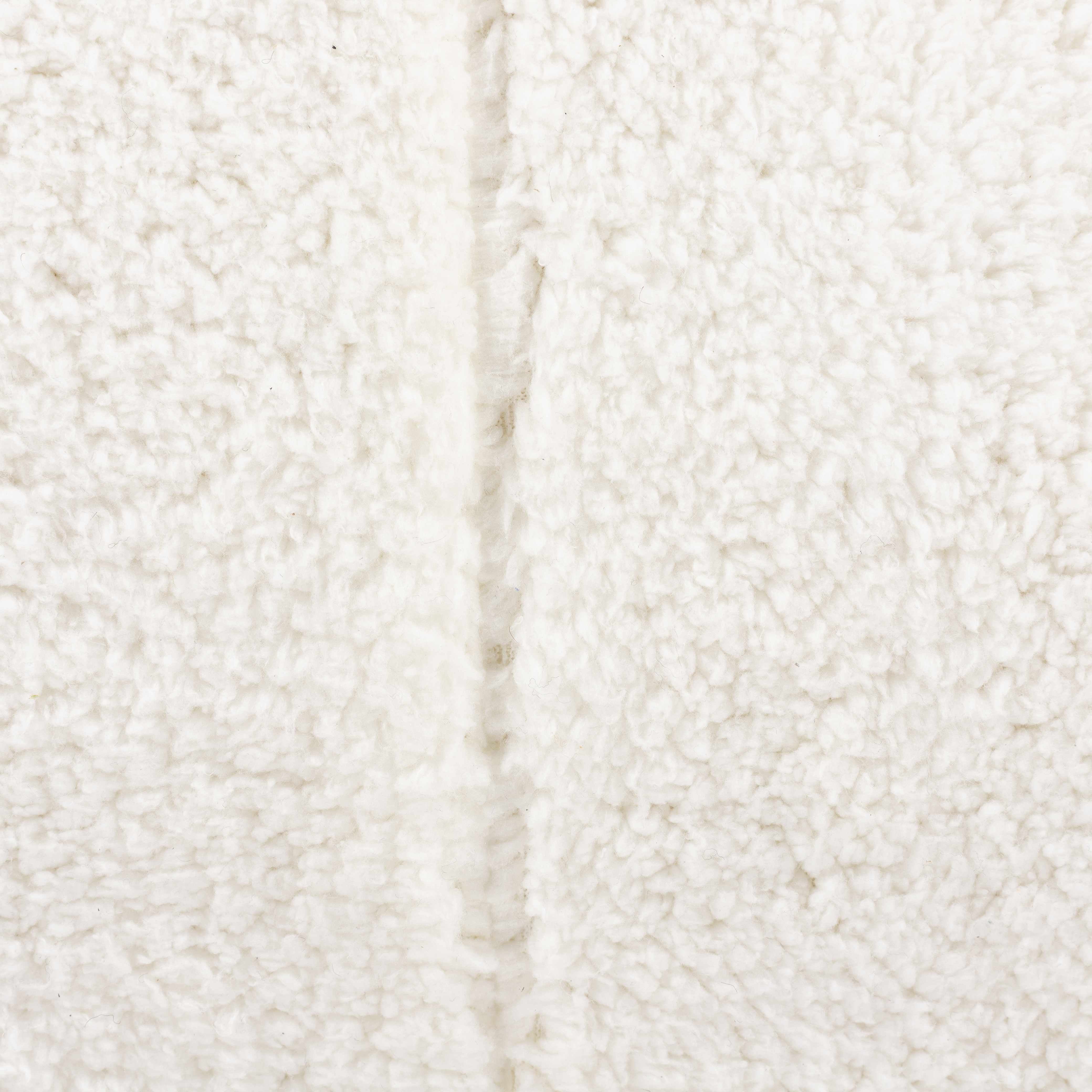 Close-up of a textured white fabric surface