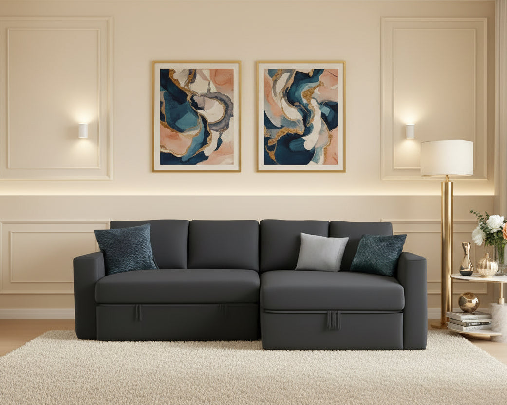 Gray sectional sofa with decorative pillows in a room with warm lighting.