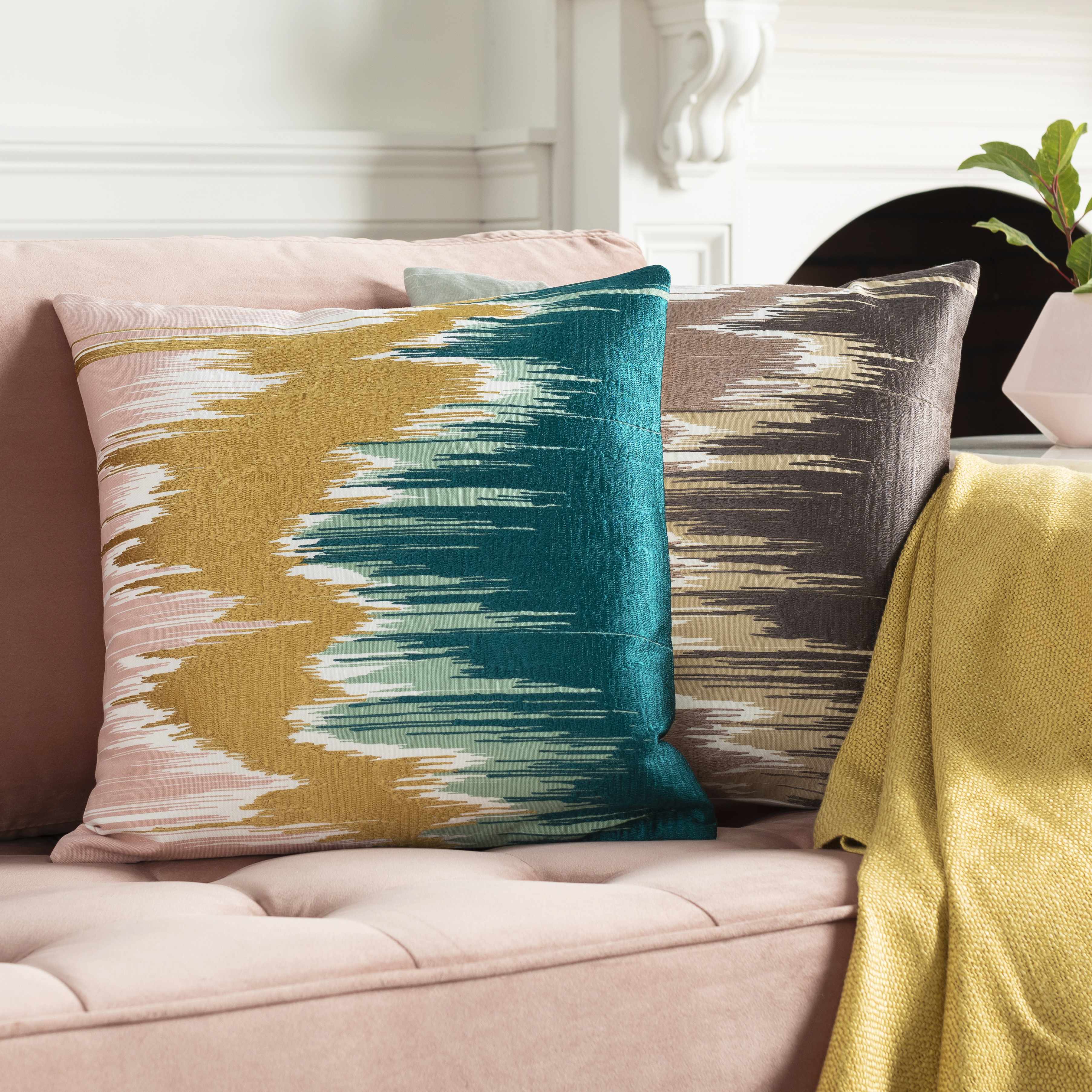 Decorative pillows with abstract patterns on a couch