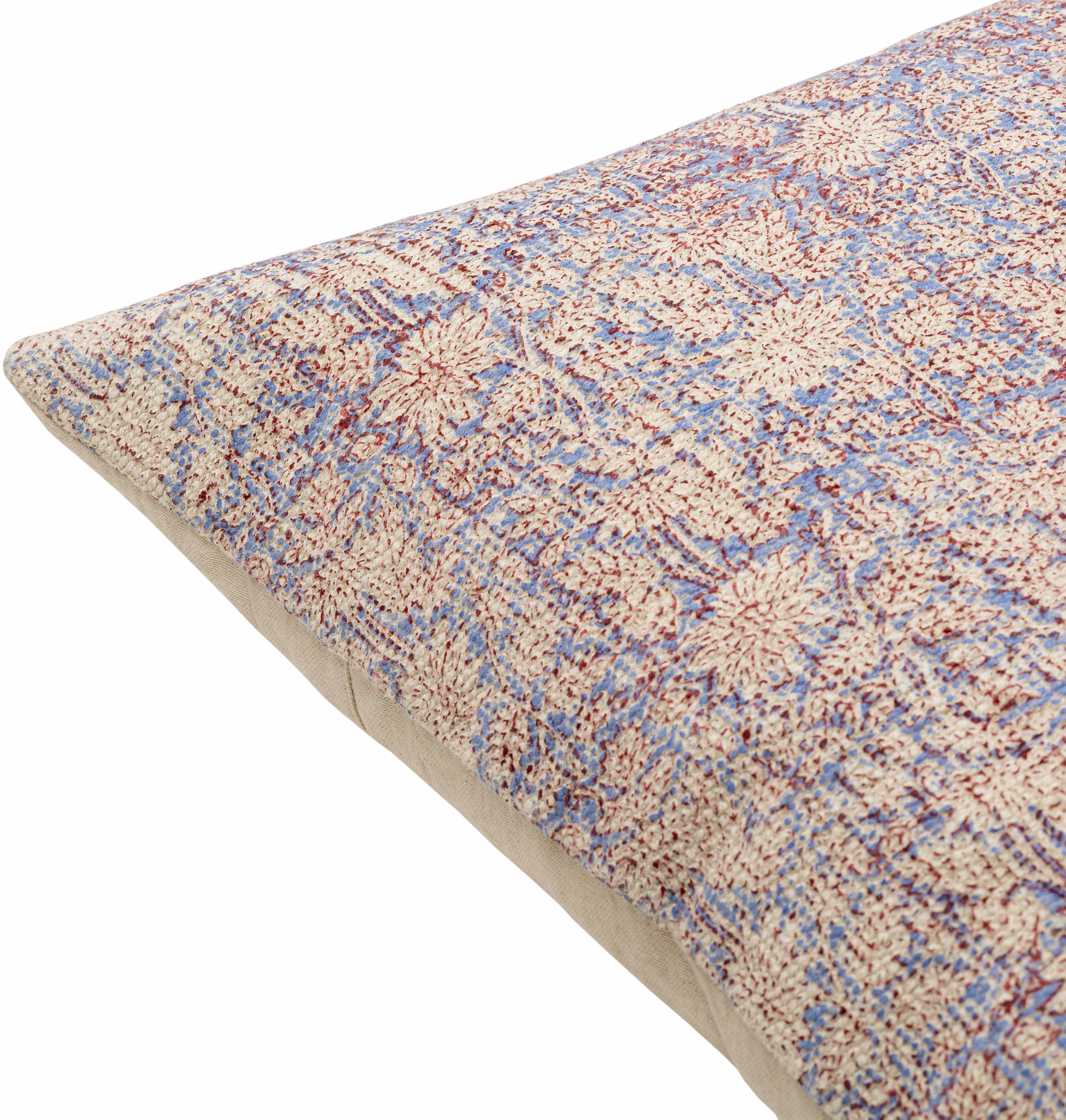 Floral patterned rug with a beige border on a white background