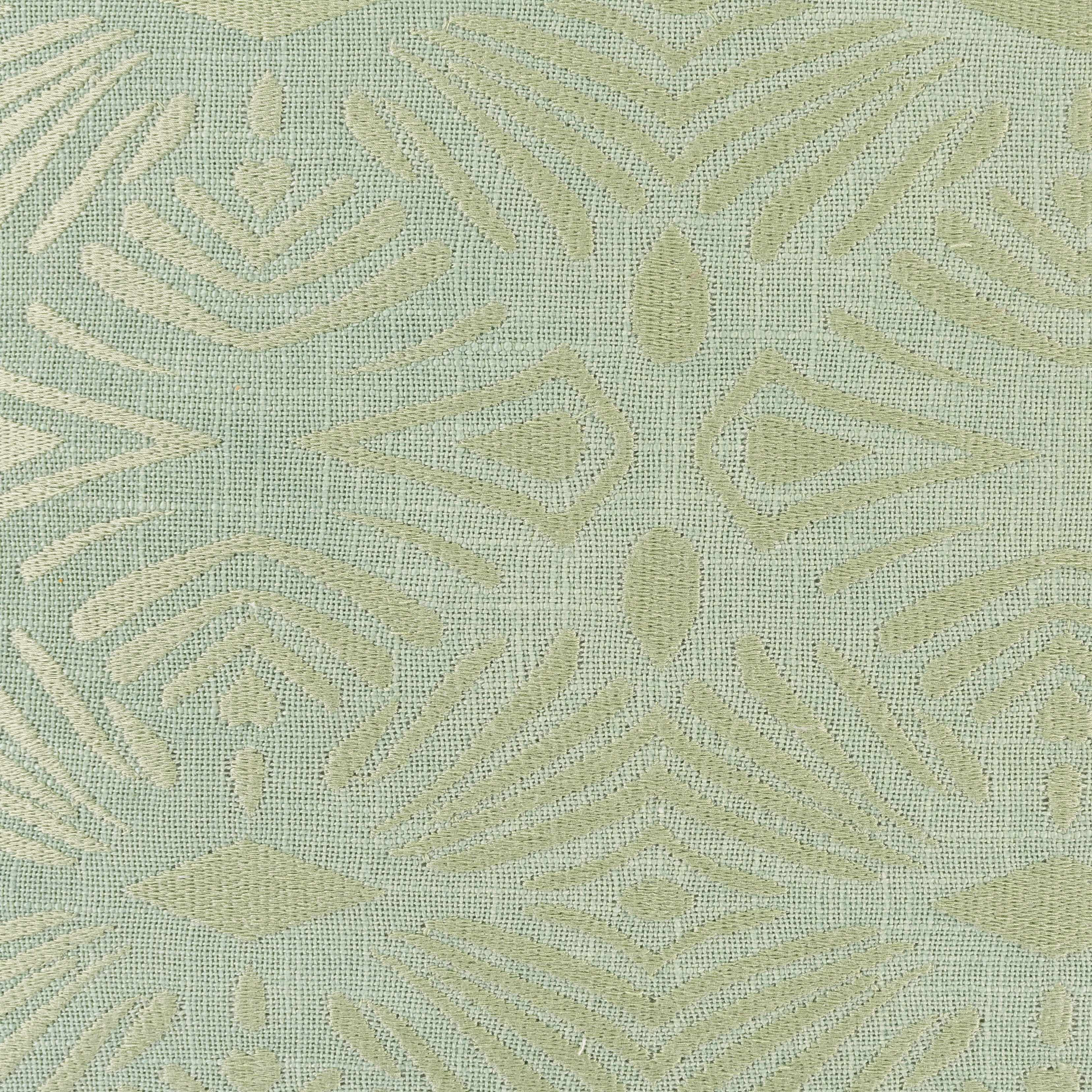 Textured fabric pattern with geometric shapes on a light green background