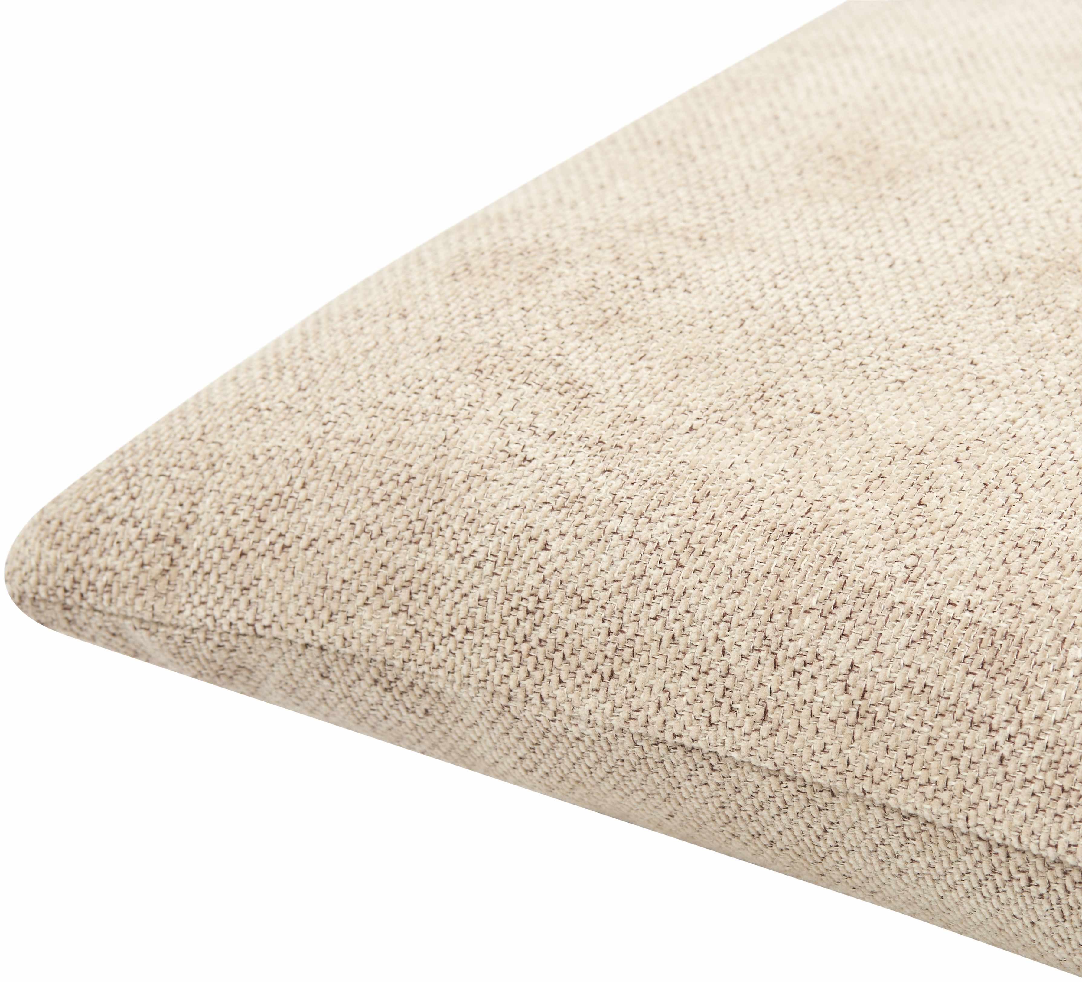 Close-up of a textured beige cushion on a white background
