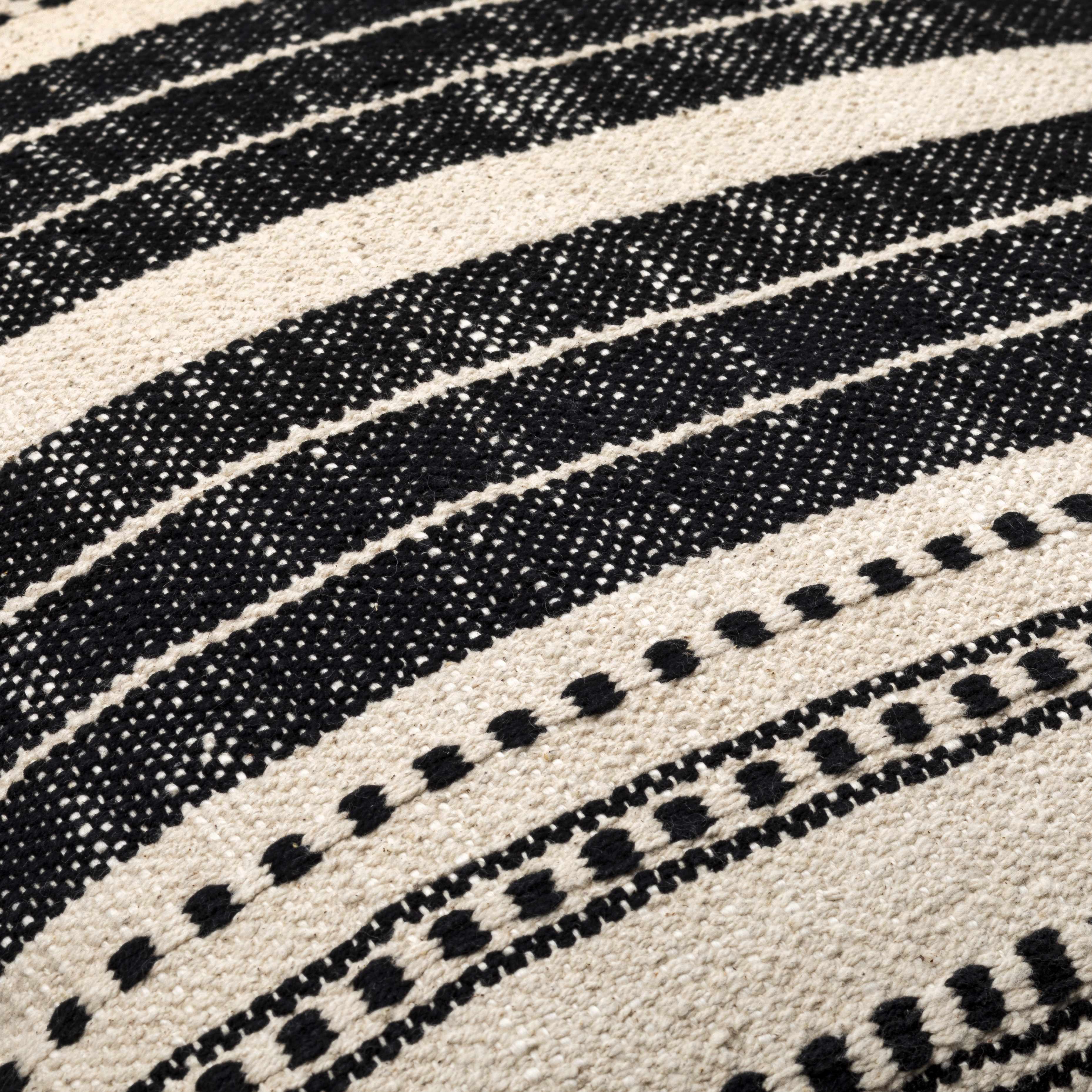 Close-up of a textured fabric with black and white pattern