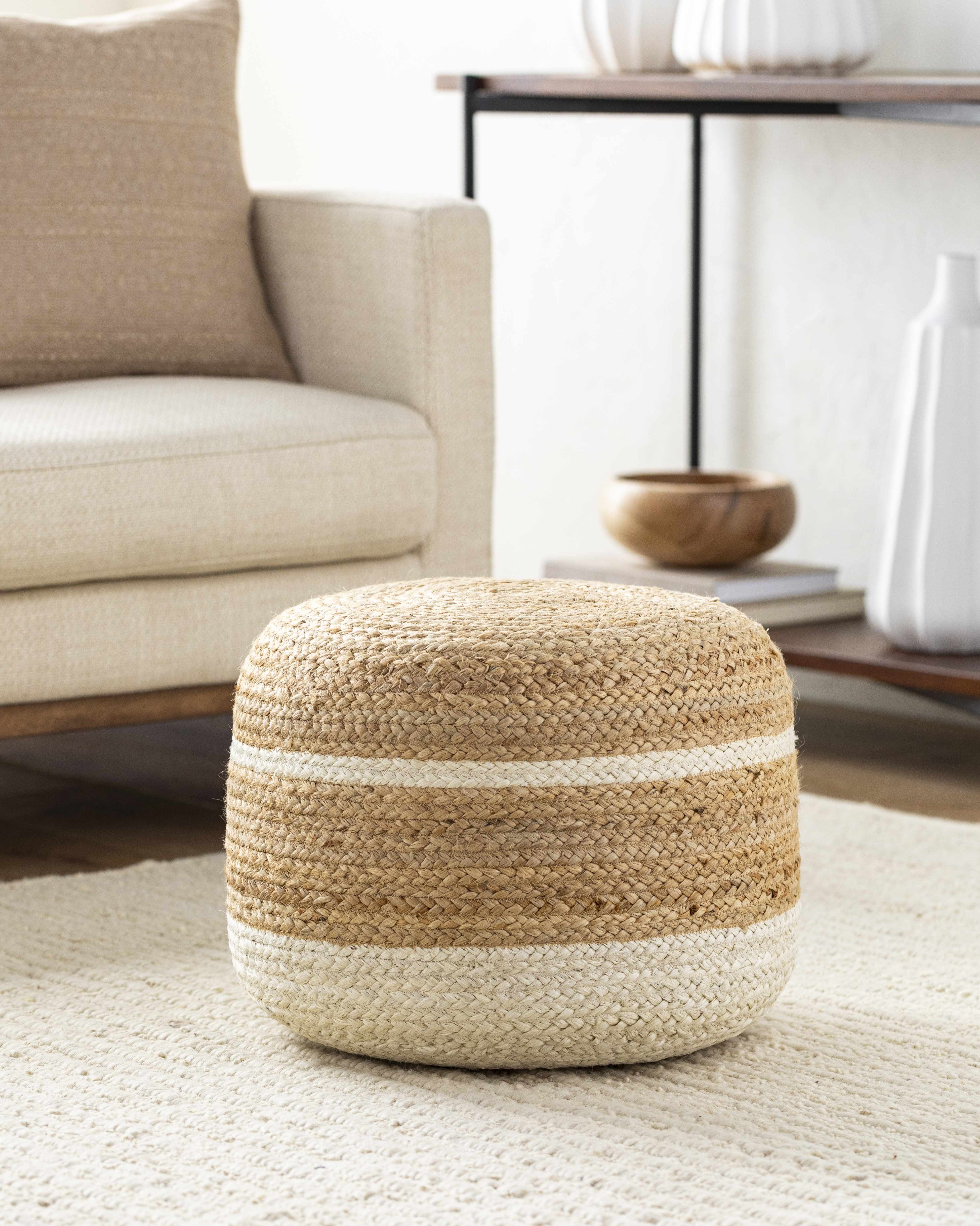 Woven ottoman with two-tone design in a living room setting