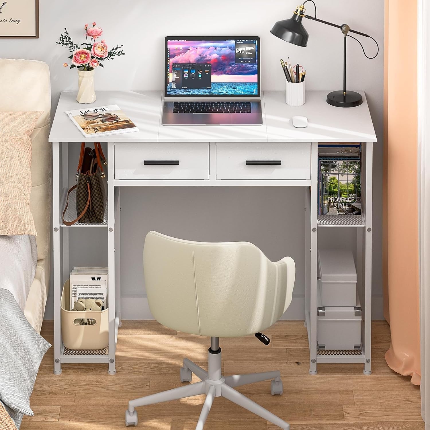 White desk with laptop, chair, and various items in a room setting