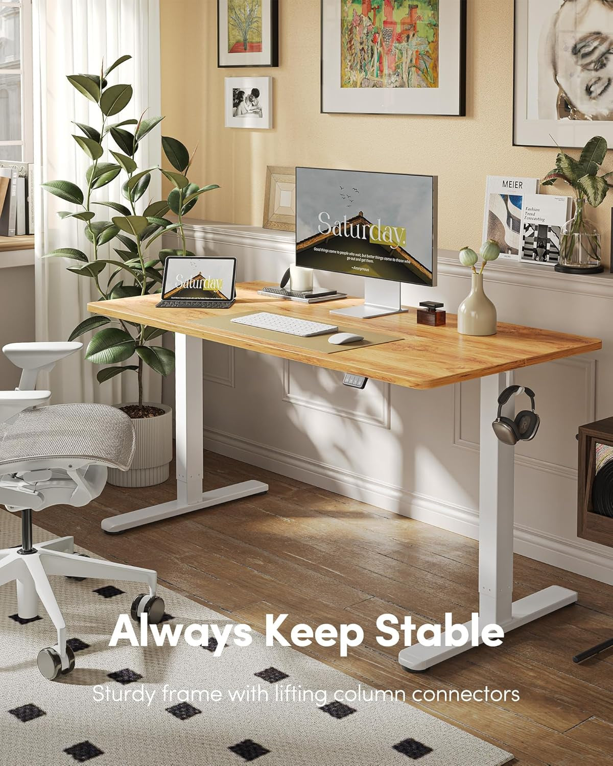 Wooden desk with computer setup in a home office, featuring the text 'Always Keep Stable'.