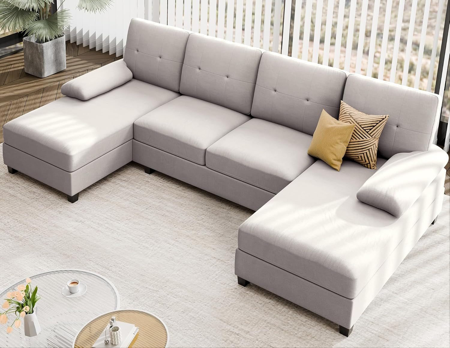 Gray sectional sofa with cushions in a living room setting