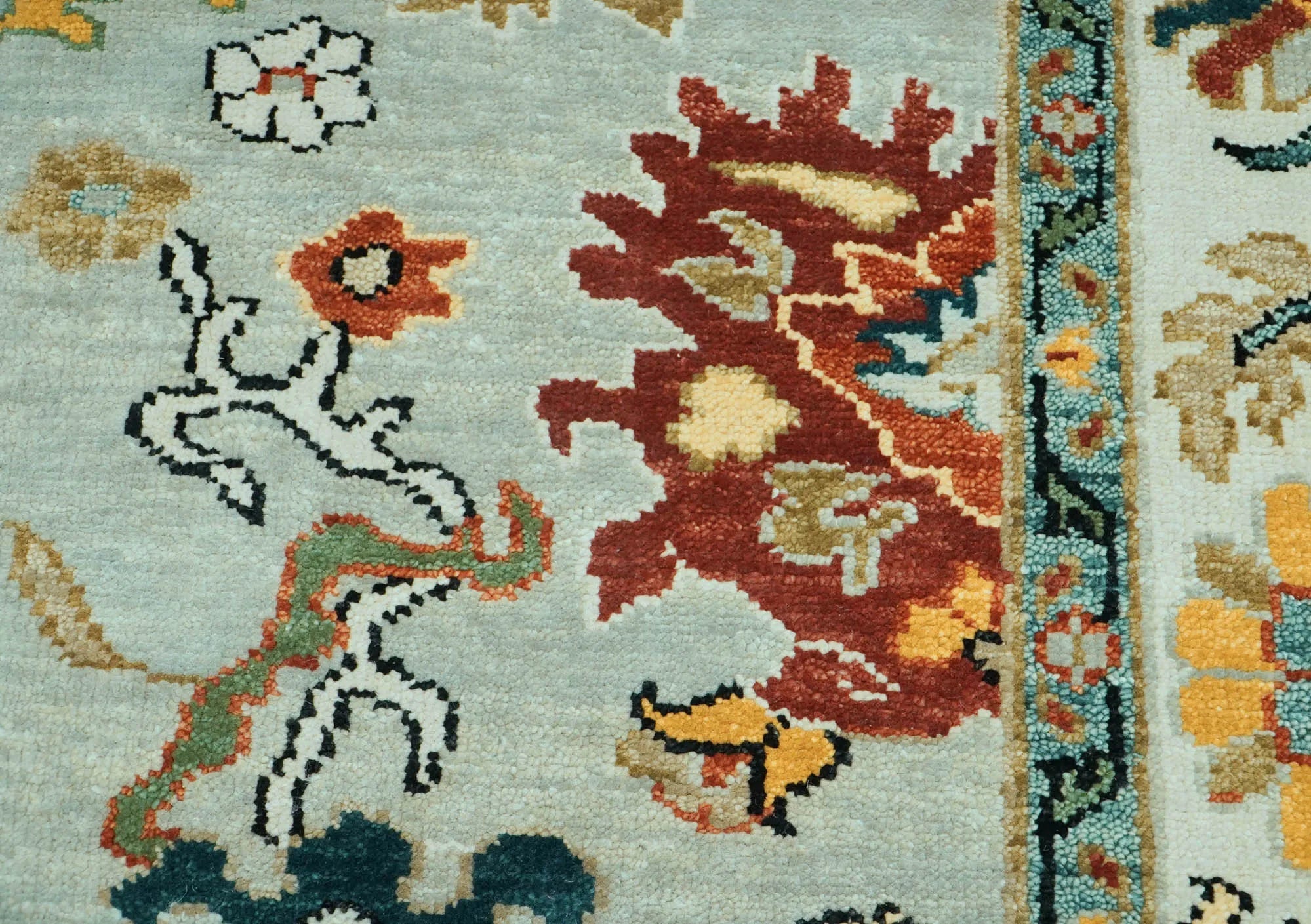 Close-up of a colorful patterned rug with intricate designs.