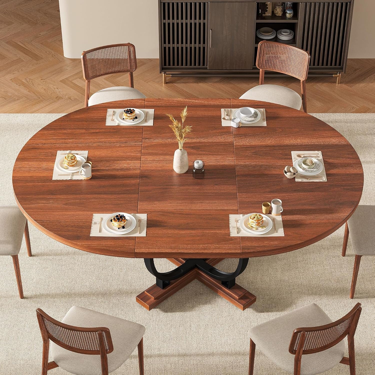 Wooden dining table set with chairs in a room with a cabinet.