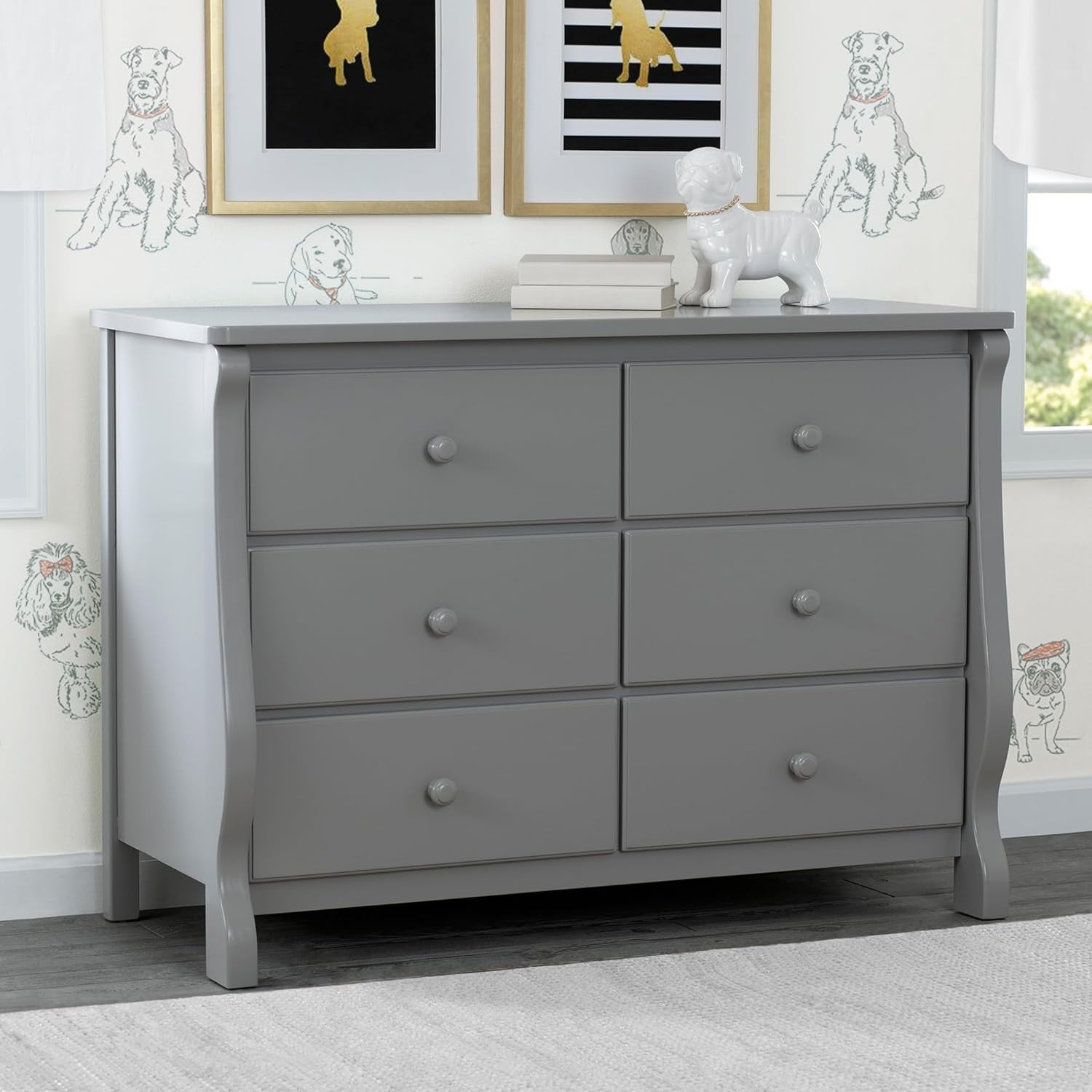 Gray dresser with six drawers in a room with dog-themed decorations on the wall.