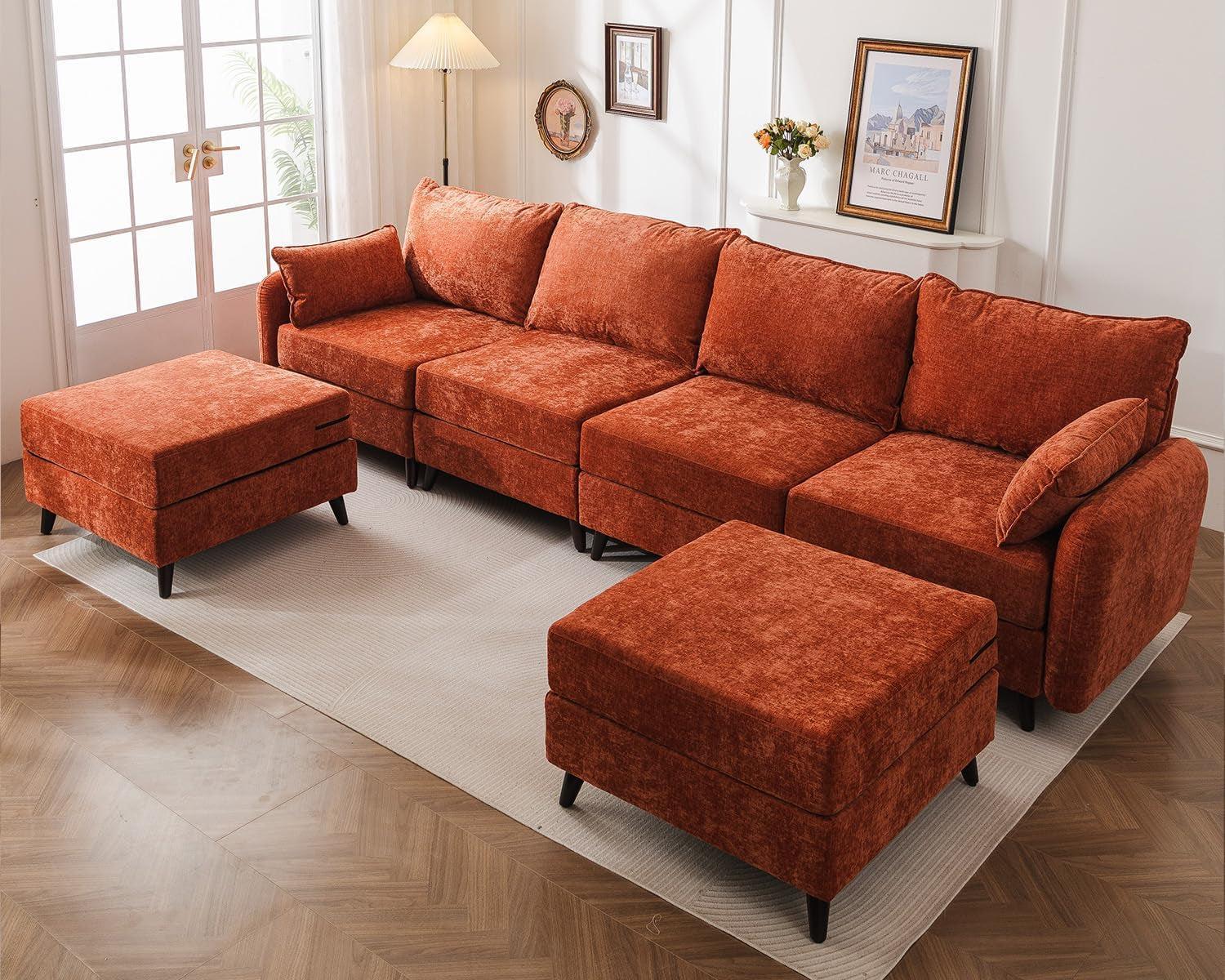 Orange sectional sofa with matching ottomans in a living room setting.