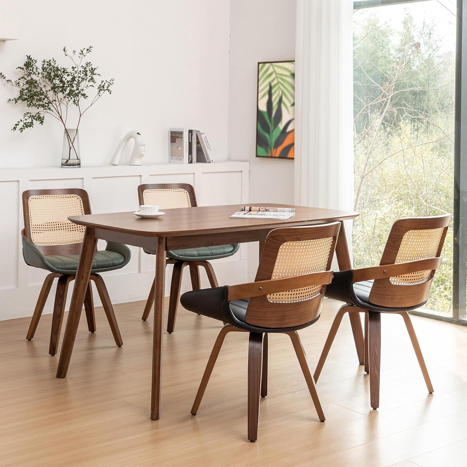 Dining room with wooden table and chairs near a large window.
