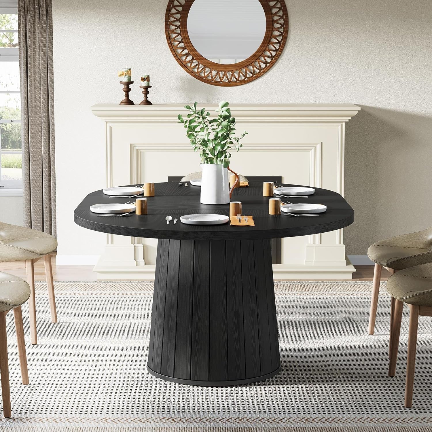 Dining room with a black round table and chairs, featuring a fireplace and decorative elements.
