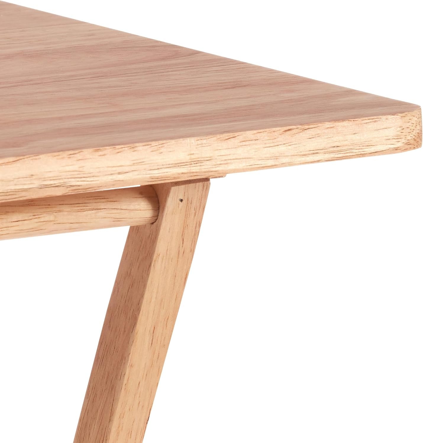 Close-up of a wooden table with a white background