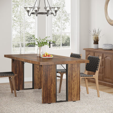 Dining room with wooden table and chairs near a large window.