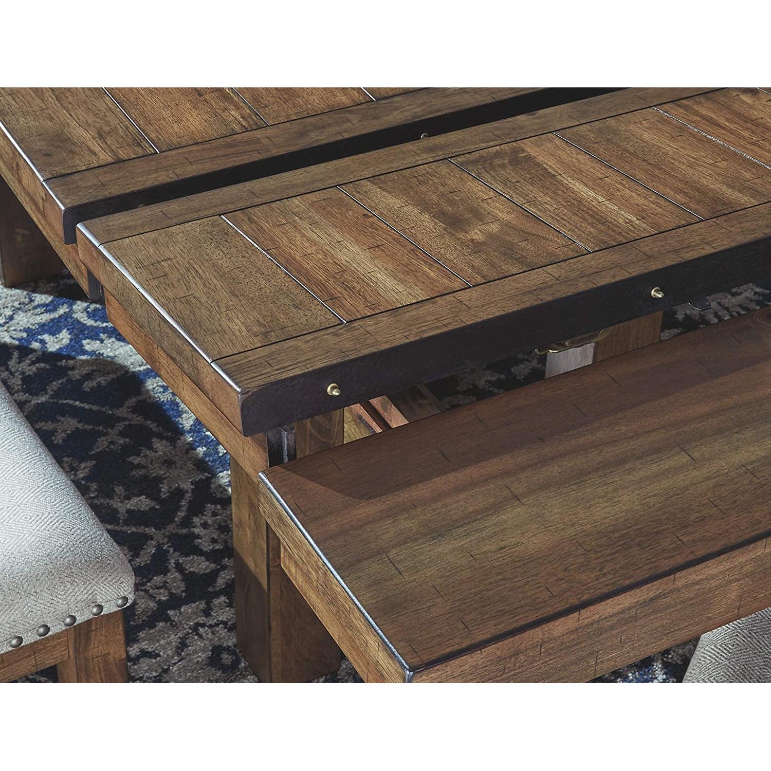 Wooden coffee table with a bench extension on a patterned rug