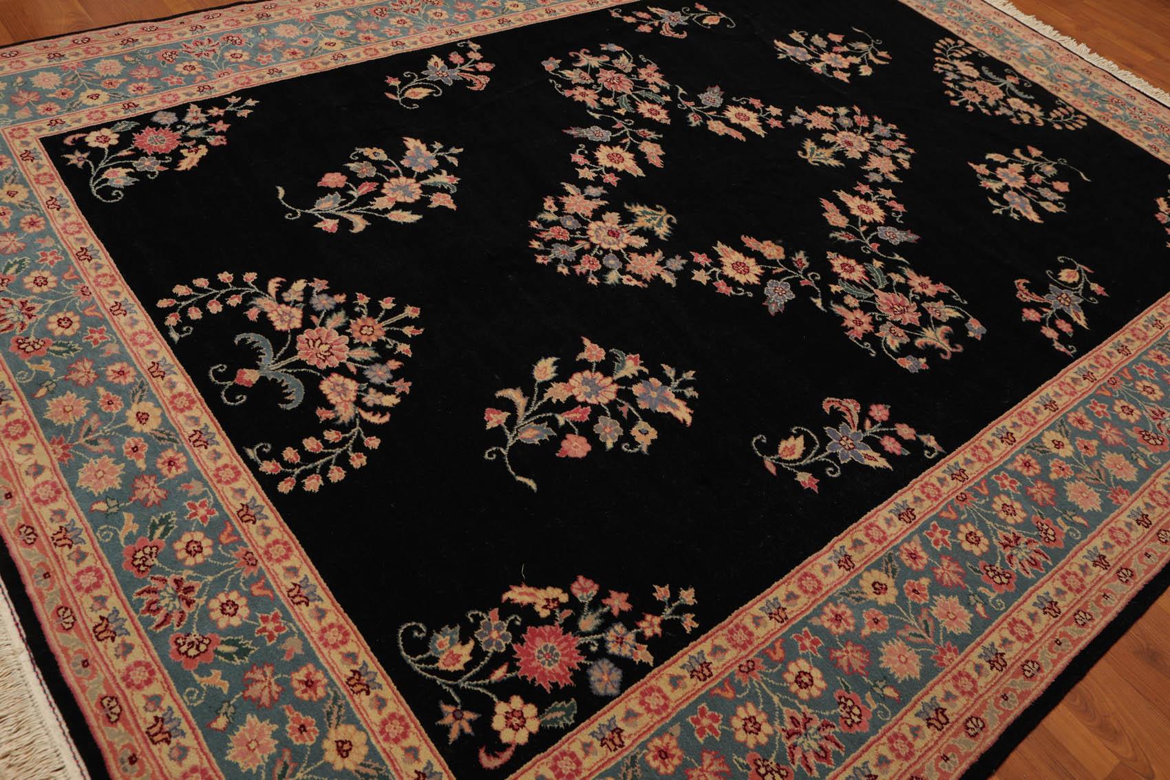 Decorative rug with floral patterns on a black background
