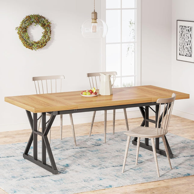 Dining room with a wooden table and chairs on a rug, decorated with a wreath and artwork.