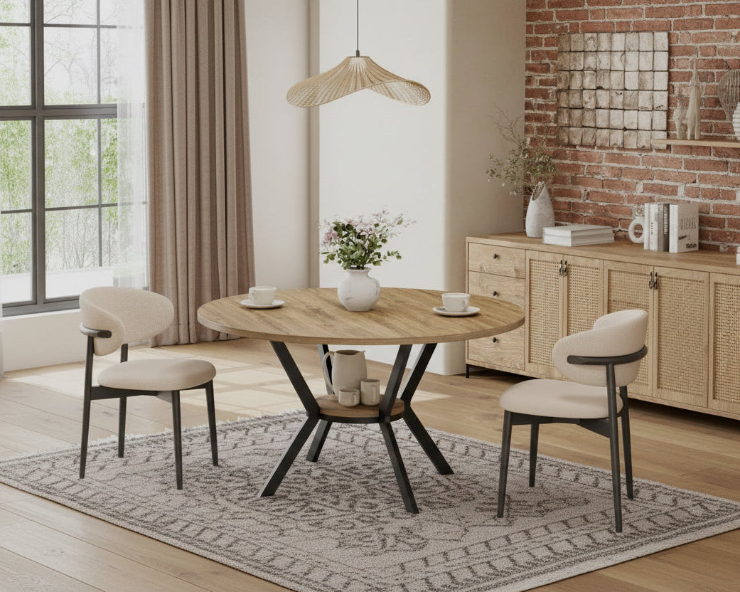 Dining room with a round wooden table and chairs, featuring storage shelf.