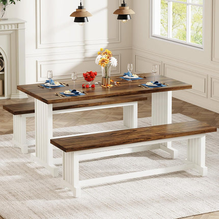 Dining room with a wooden table and benches, set for a meal.
